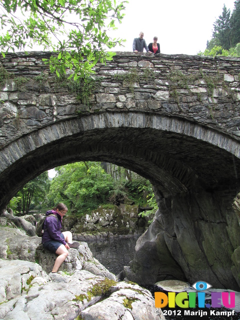 SX23135 Jenni on rocks by bridge over Afon Conwy at Betws-Y-Coed